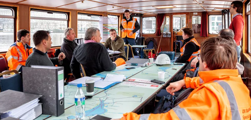 Construction workers at a meeting