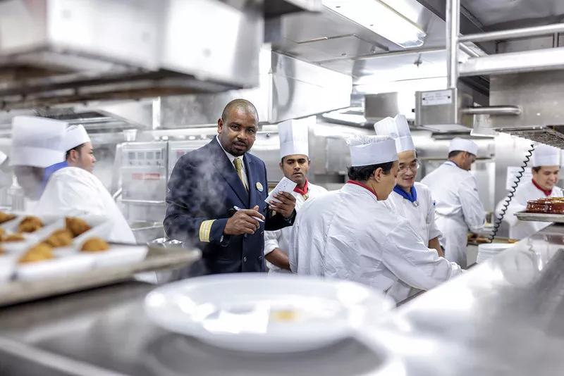 Kitchen workers are visited by manager