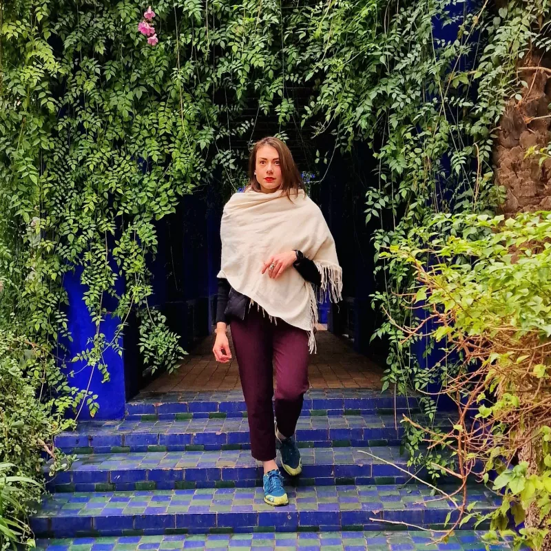 Woman walking down the stairs; Trees shown on the side