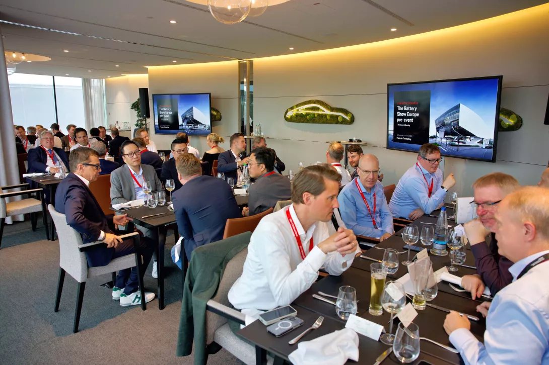 Guests sitting at the battery show europe pre-event hosted by porsche consulting