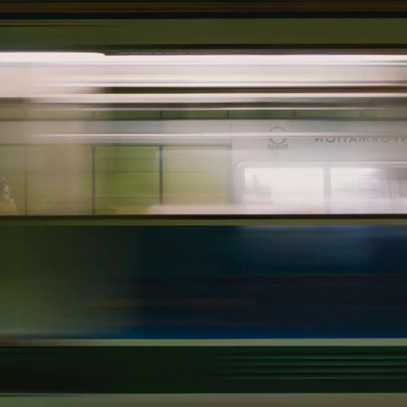 Picture of a man with light blue shirt and dark blue jumper