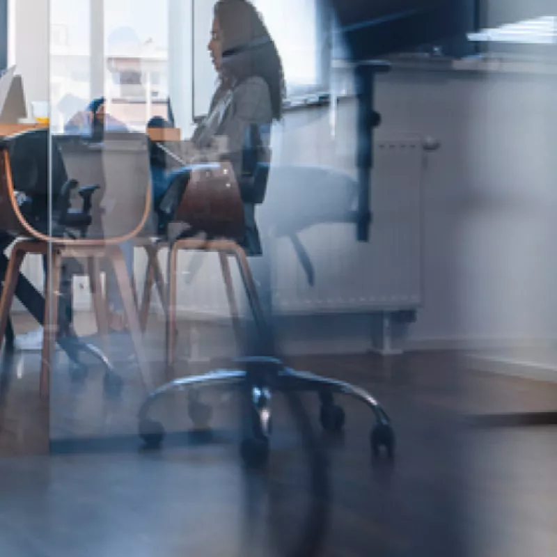 Sitting man in a suit discussing gesticulating 