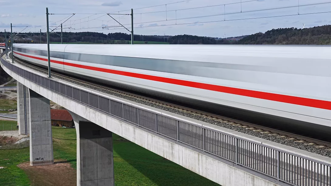 Deutsche Bahn Train rides on bridge