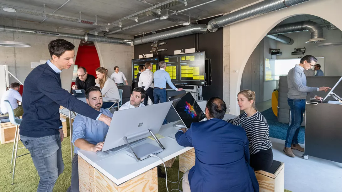 A team of several colleagues working in a creative office 