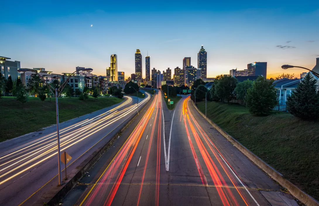 Atlanta Skyline with speeding cars going by
