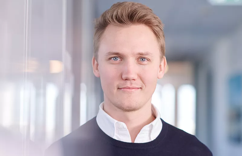 Portrait of a slightly smiling young consultant